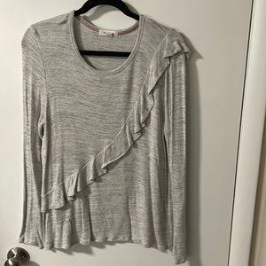 Lightweight sweater with front and back riffle detail. Boutique